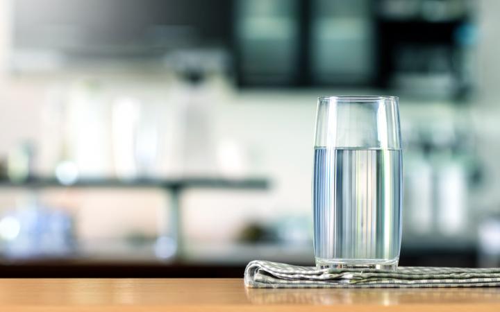 A glass of water on a benchtop